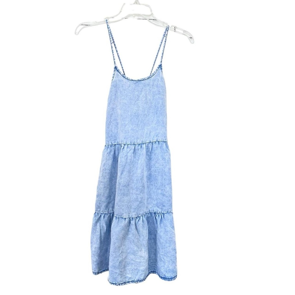 Blue denim tiered mini dress with adjustable straps and ruffle trim #Minidress